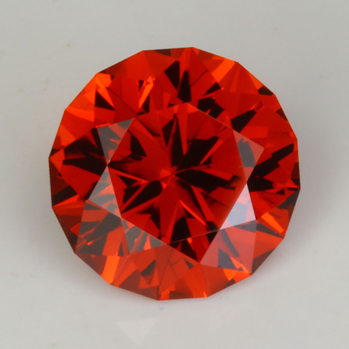 round reddish orange spessartite garnet