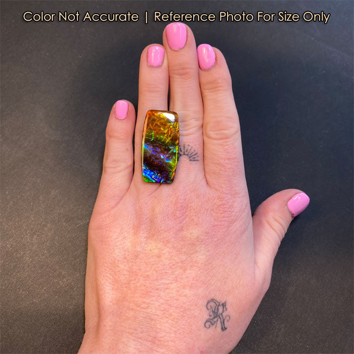 rainbow color ammolite gem on hand