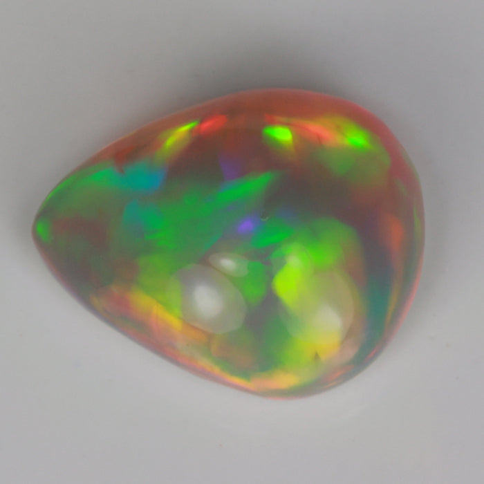 opal pear shape cabochon cut semi black color