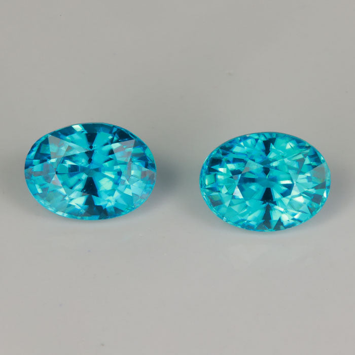 oval cut greenish blue zircon gemstone pair