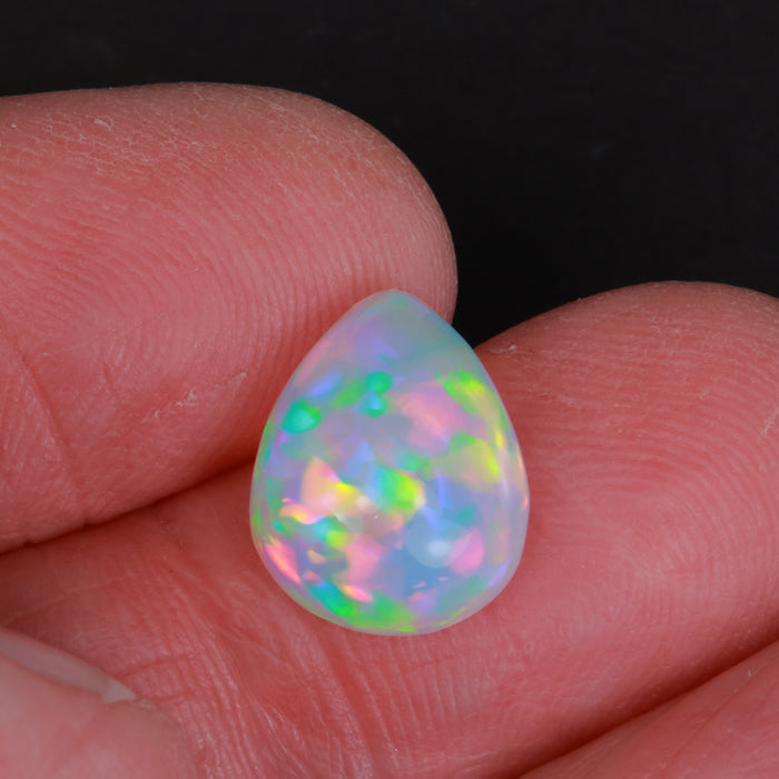 pear shape opal in hand