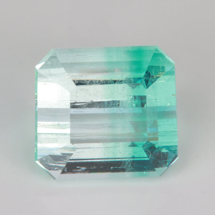 Emerald cut bicolor banded gem green and clear beryl