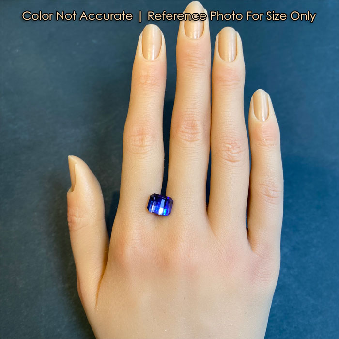 blue violet pixel cut tanzanite on hand size reference