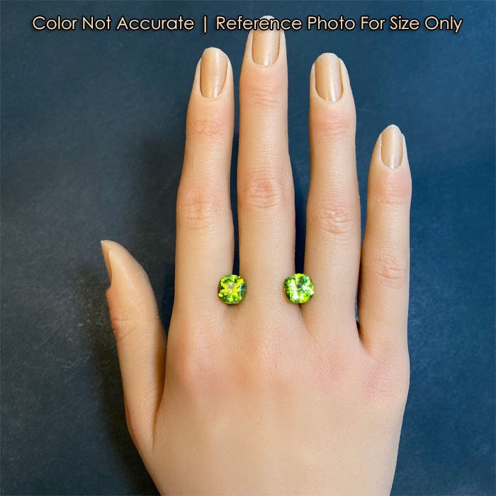 green peridot gems on hand