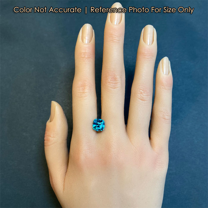 size of a beautiful blue zircon gem on hand