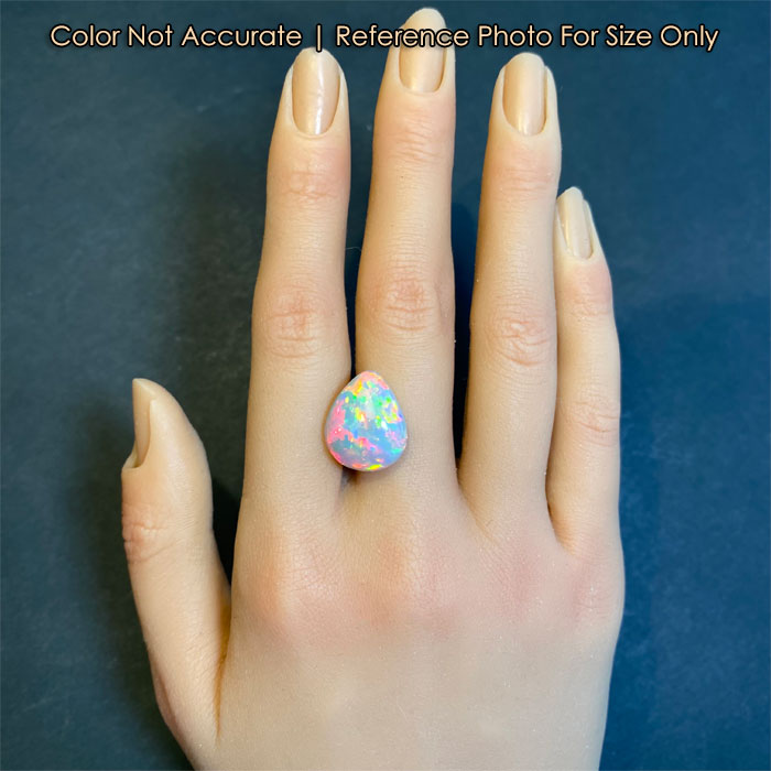 pear cabochon opal on hand