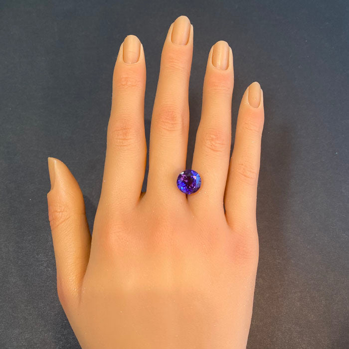 round brilliant cut tanzanite gemstone red flash