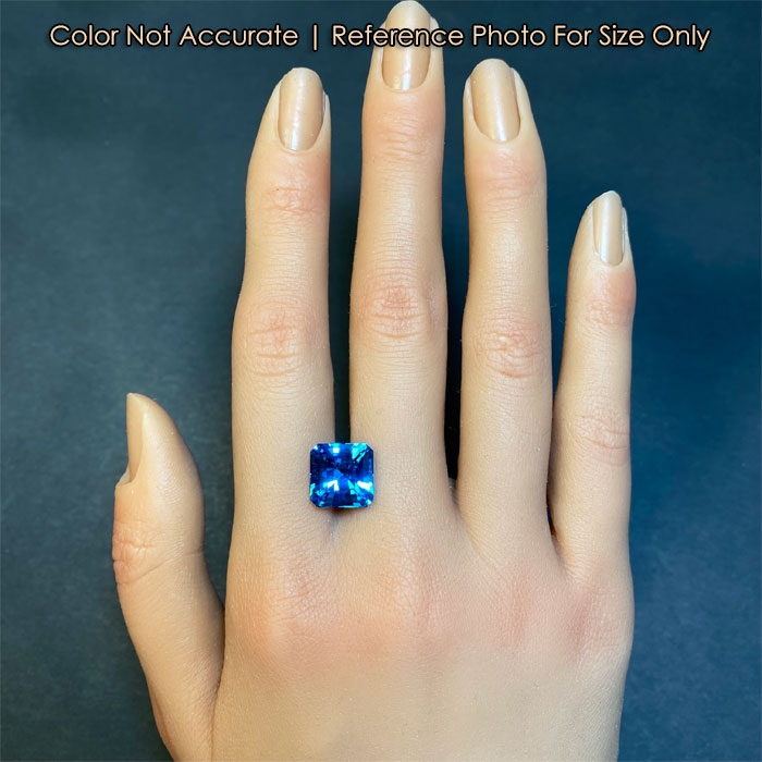 topaz gemstone on hand swiss blue color