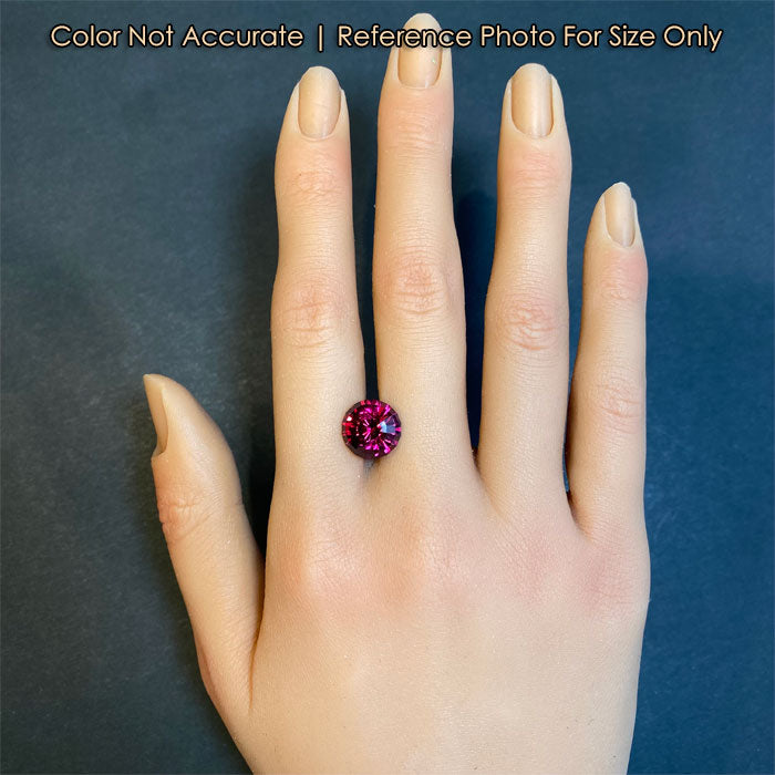 step cut natural rhodolite garnet gemstone size on a hand