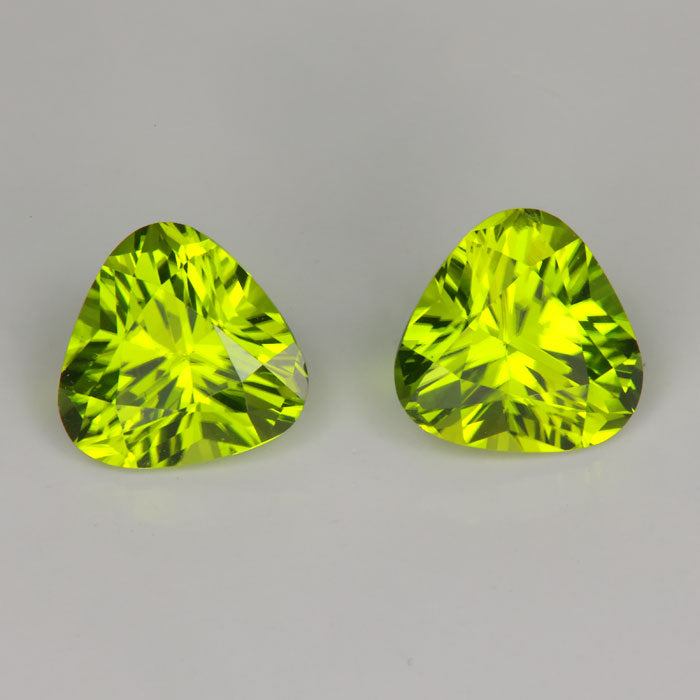 green color trilliant cut pair of peridot gemstones