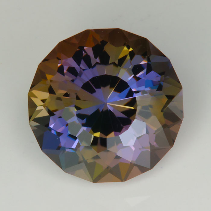 blue brown round portuguese cut tanzanite