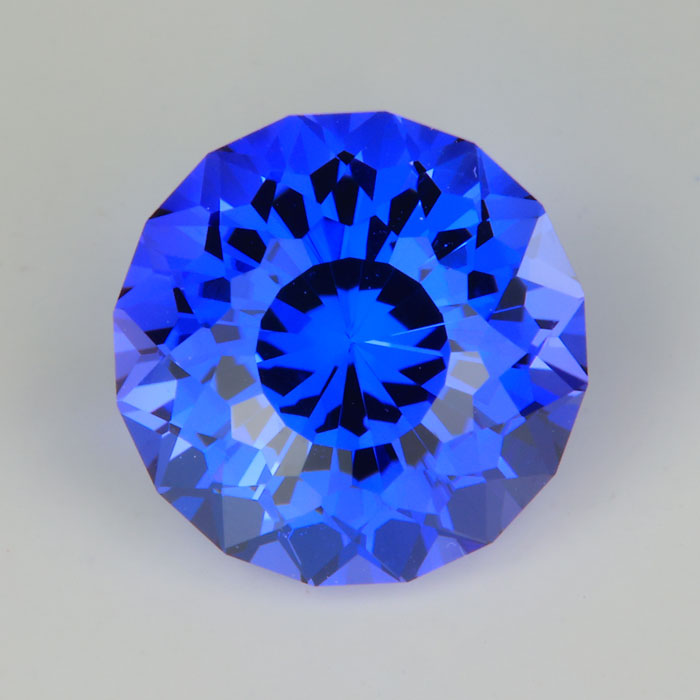 mostly blue tanzanite gem round portuguese cut heated color 