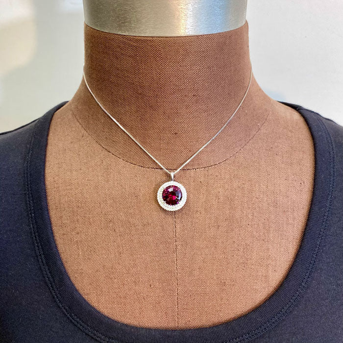 white gold pendant with garnet gemstone and diamonds