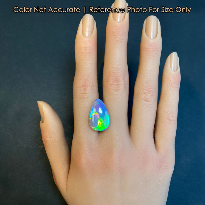 top crystal opal gem on a hand