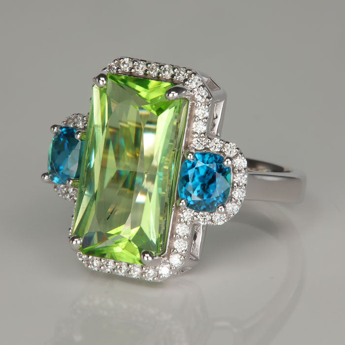 white gold peridot gemstone ring with blue zircon and diamonds
