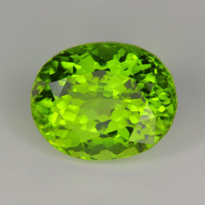 green natural color oval cut peridot gemstone from Pakistan 