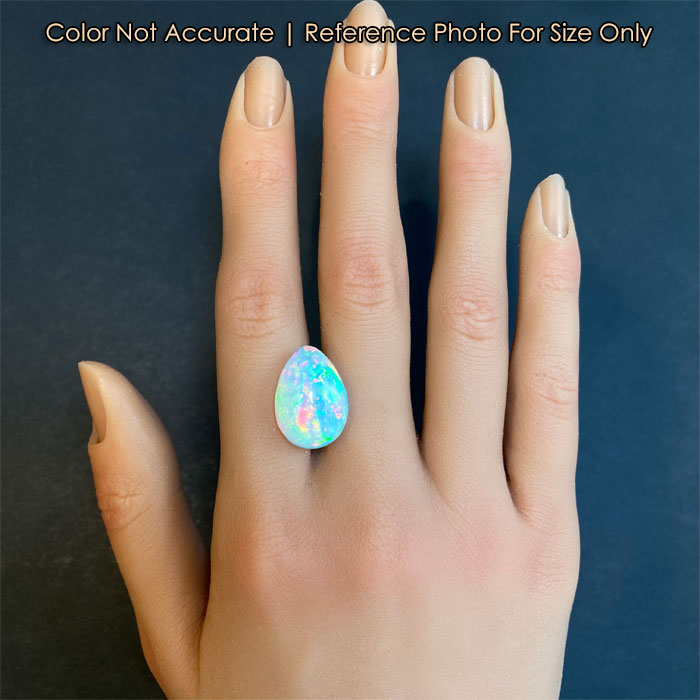 pear shape cabochon opal on hand