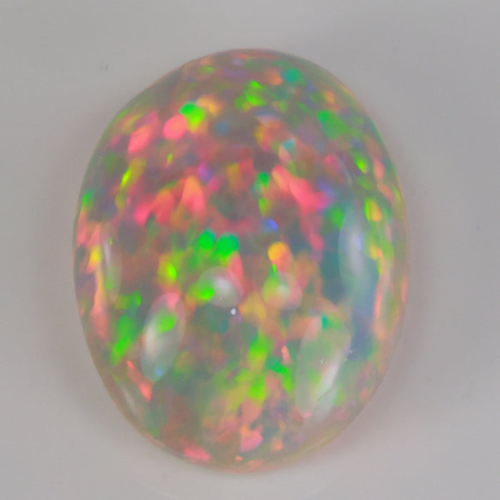 oval cabochon cut semi black opal gemstone from ethiopia