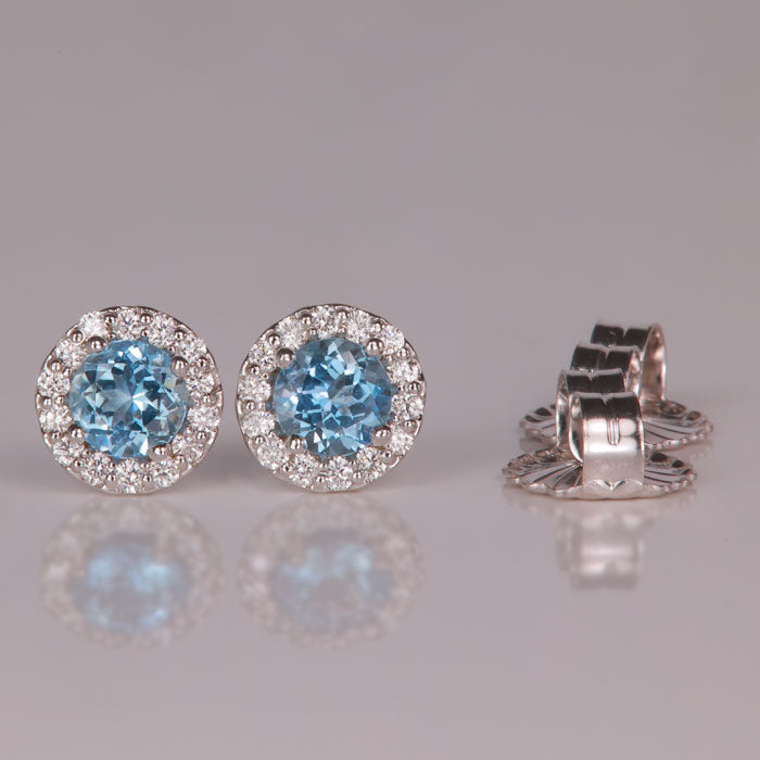 round brilliant blue aquamarine gemstone earrings with diamond halo