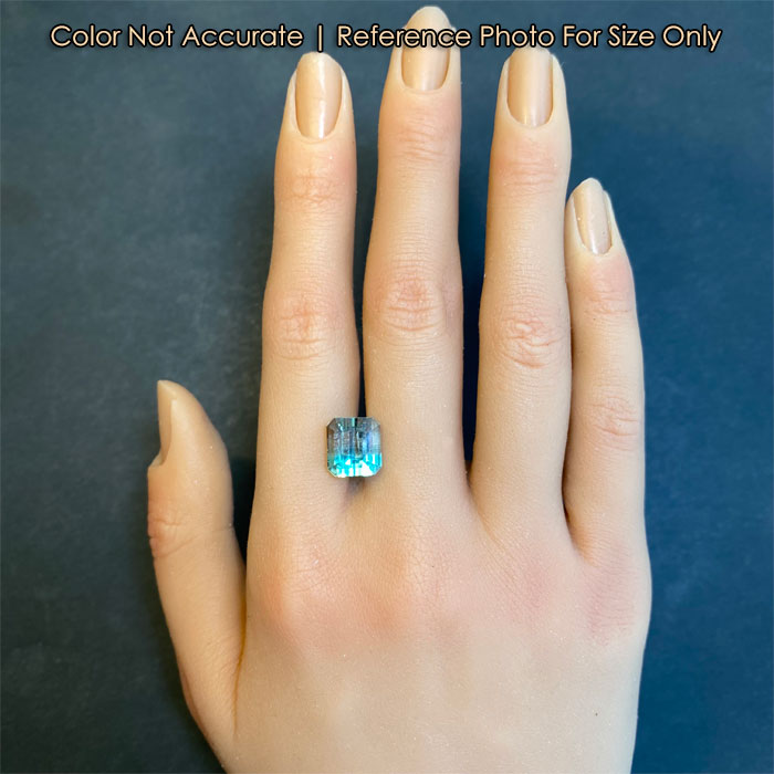 green and clear bicolor beryl size to hand