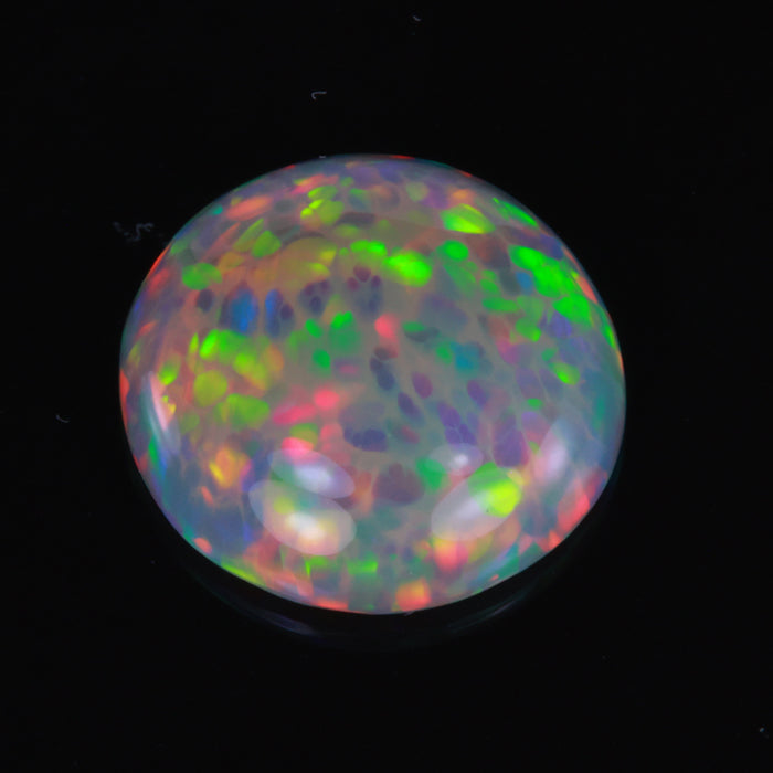 round cut black opal gem