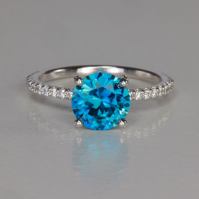 white gold round brilliant blue zircon ring with diamonds