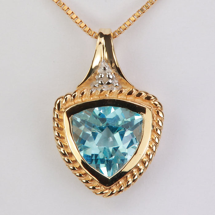 trilliant cut greenish blue topaz pendant in yellow gold 
