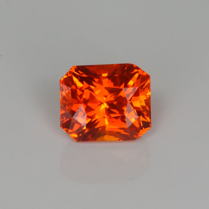 orange sapphire brilliant emerald cut