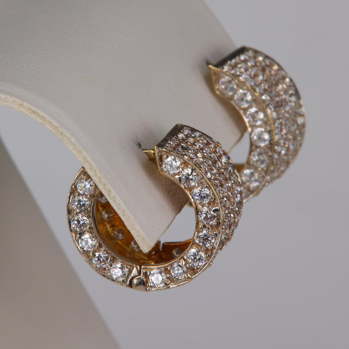yellow gold huggie hoops with cubic zirconia accents