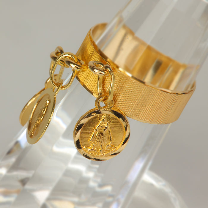 gold medallion ring with religious symbols