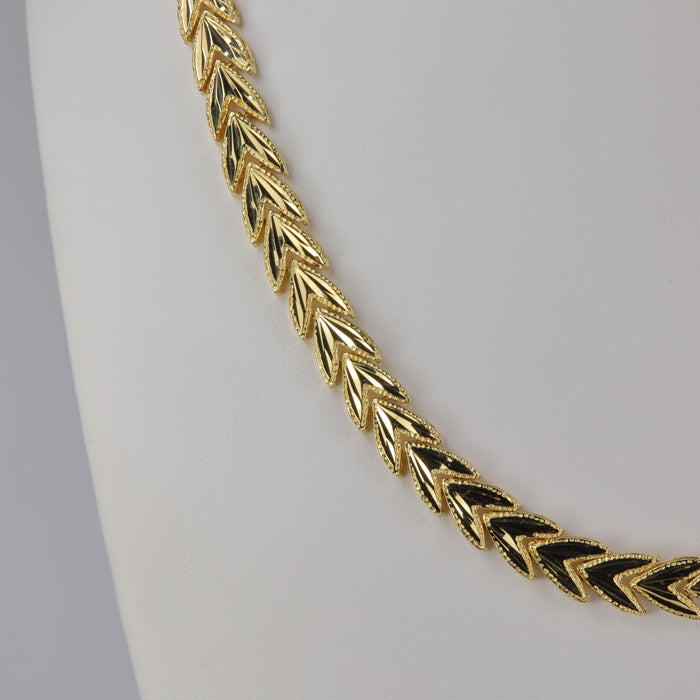 yellow gold chevron diamond cut necklace