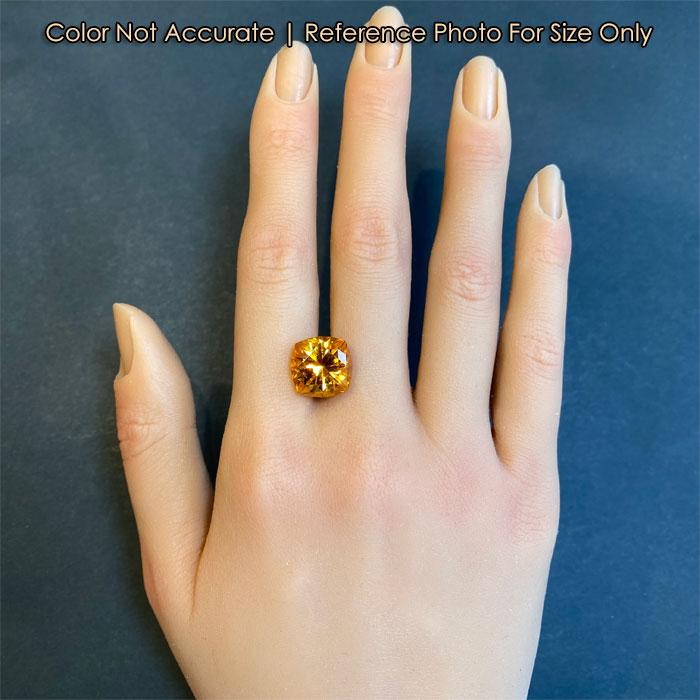citrine gemstone on hand for size