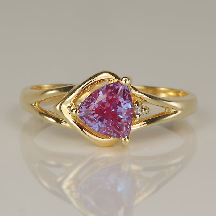 color change synthetic sapphire ring in yellow gold old trilliant cut