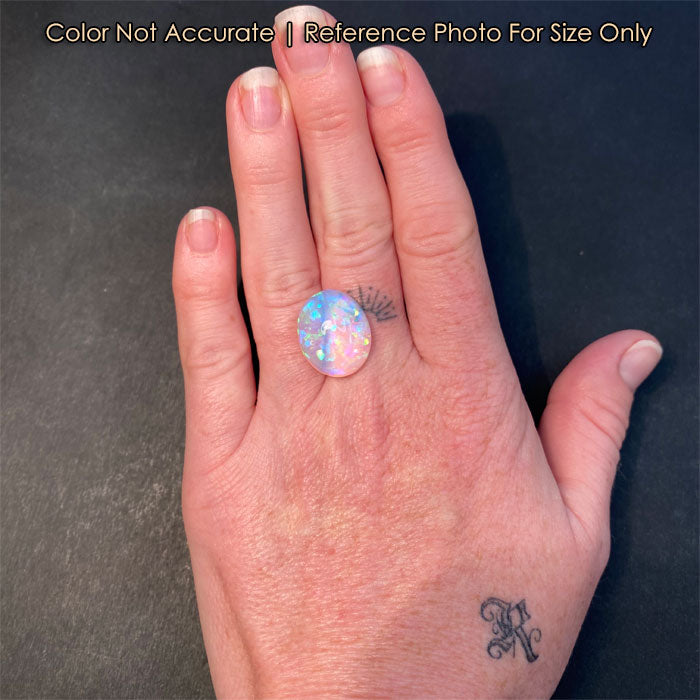 opal rainbow color gem on hand
