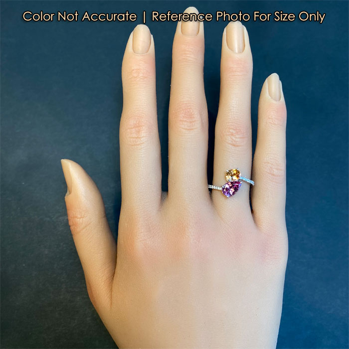 pink and orange garnet ring on hand for size