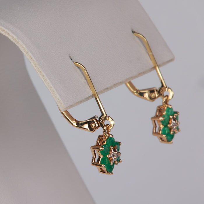estate earrings with emeralds and diamond accents in yellow gold