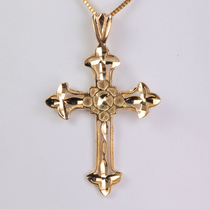 yellow gold cross pendant with diamond cut designs