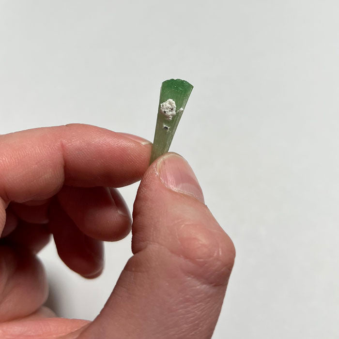 tourmaline crystal in hand