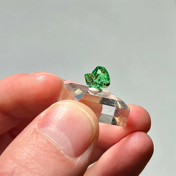 gemmy green garnet in hand