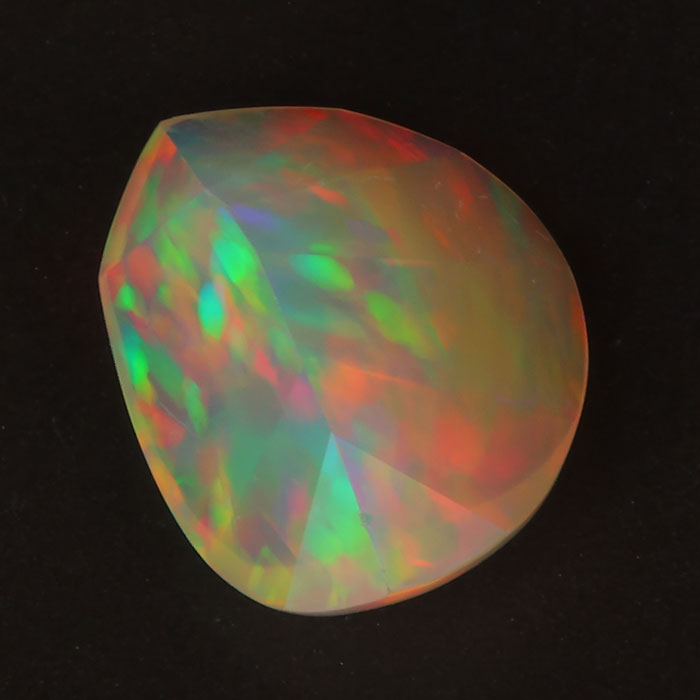 faceted opal gemstone freeform cut rainbow color