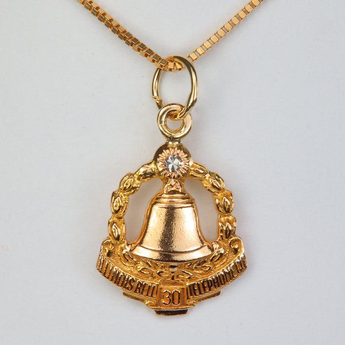 yellow gold bell telephone pendant with diamond