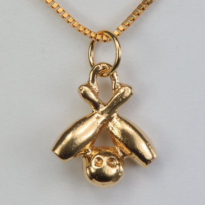 yellow gold bowling pins and ball estate pendant charm