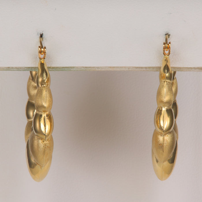 earrings in yellow gold puffy design