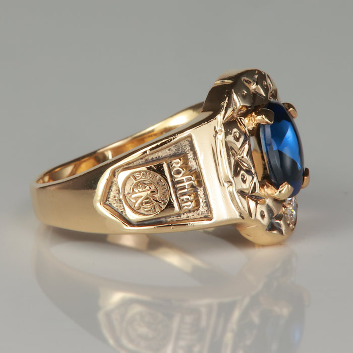 yellow gold roffler ring with diamond accent and synthetic sapphire