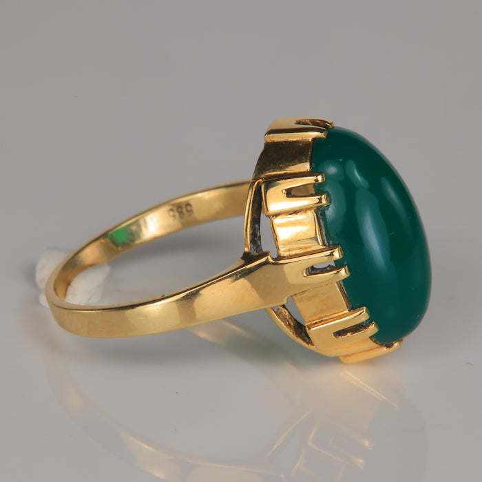 yellow gold and green glass ring