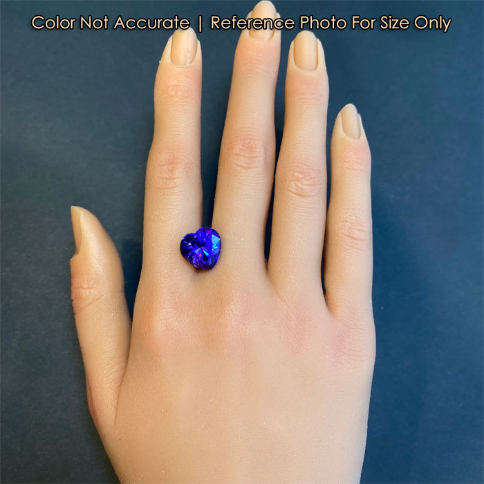 tanzanite heart on hand for size reference