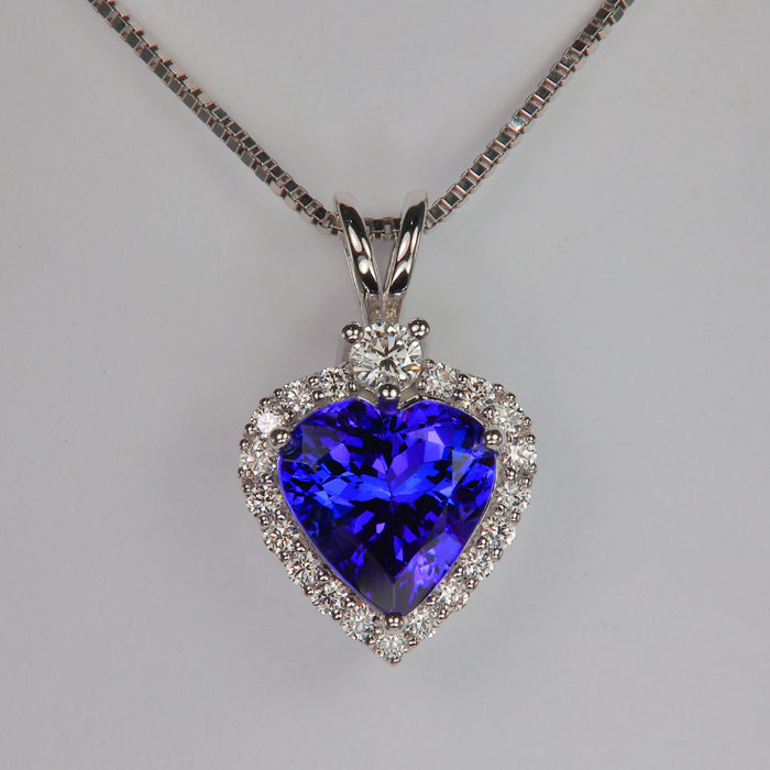 heart shape tanzanite gemstone pendant in white gold with diamonds and xoxoxo