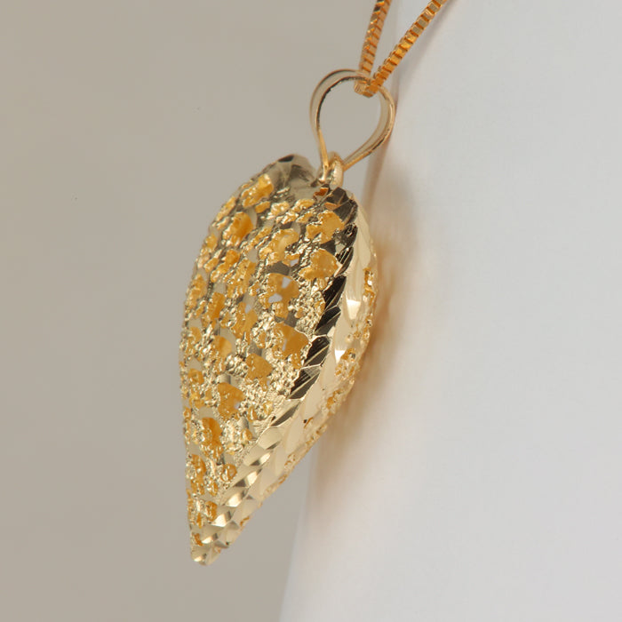 gold heart pendant diamond cut and filigree