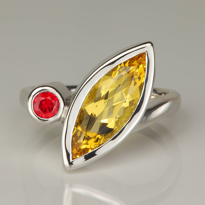 yellow heliodor gemstone ring in platinum with ruby gem accent