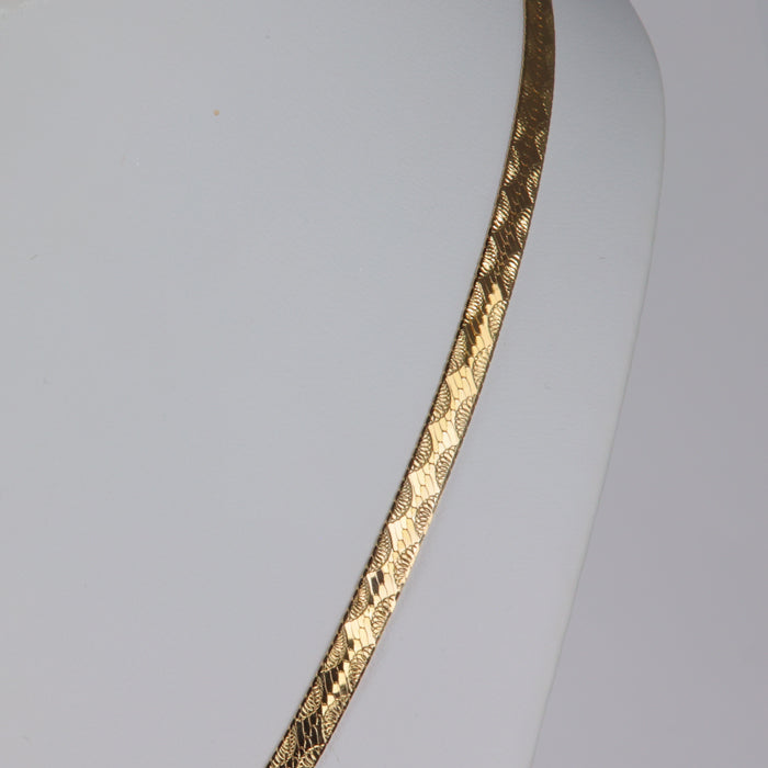 yellow gold herringbone chain with half moon design